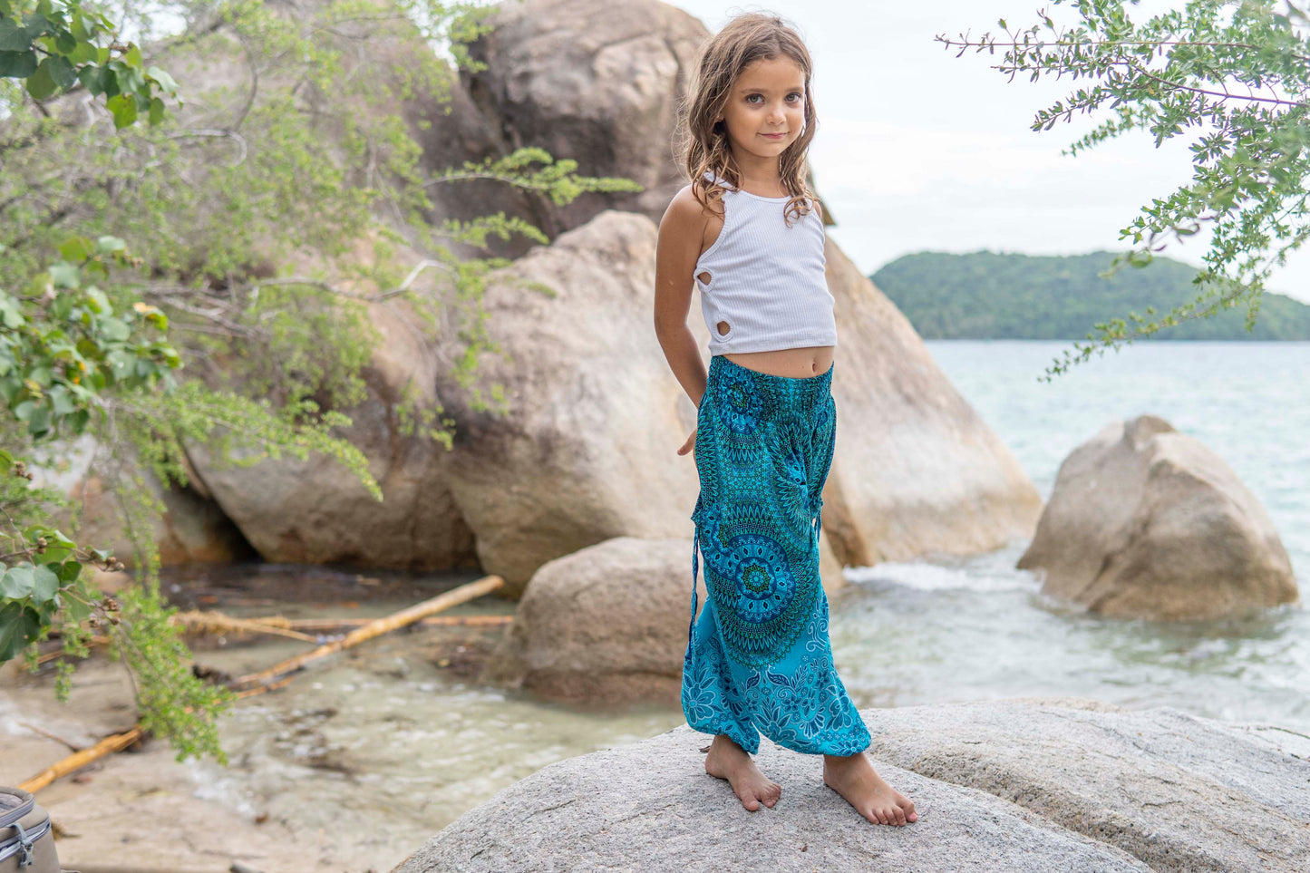 Patterned harem pants with a mandala pattern in blue and turquoise for children 