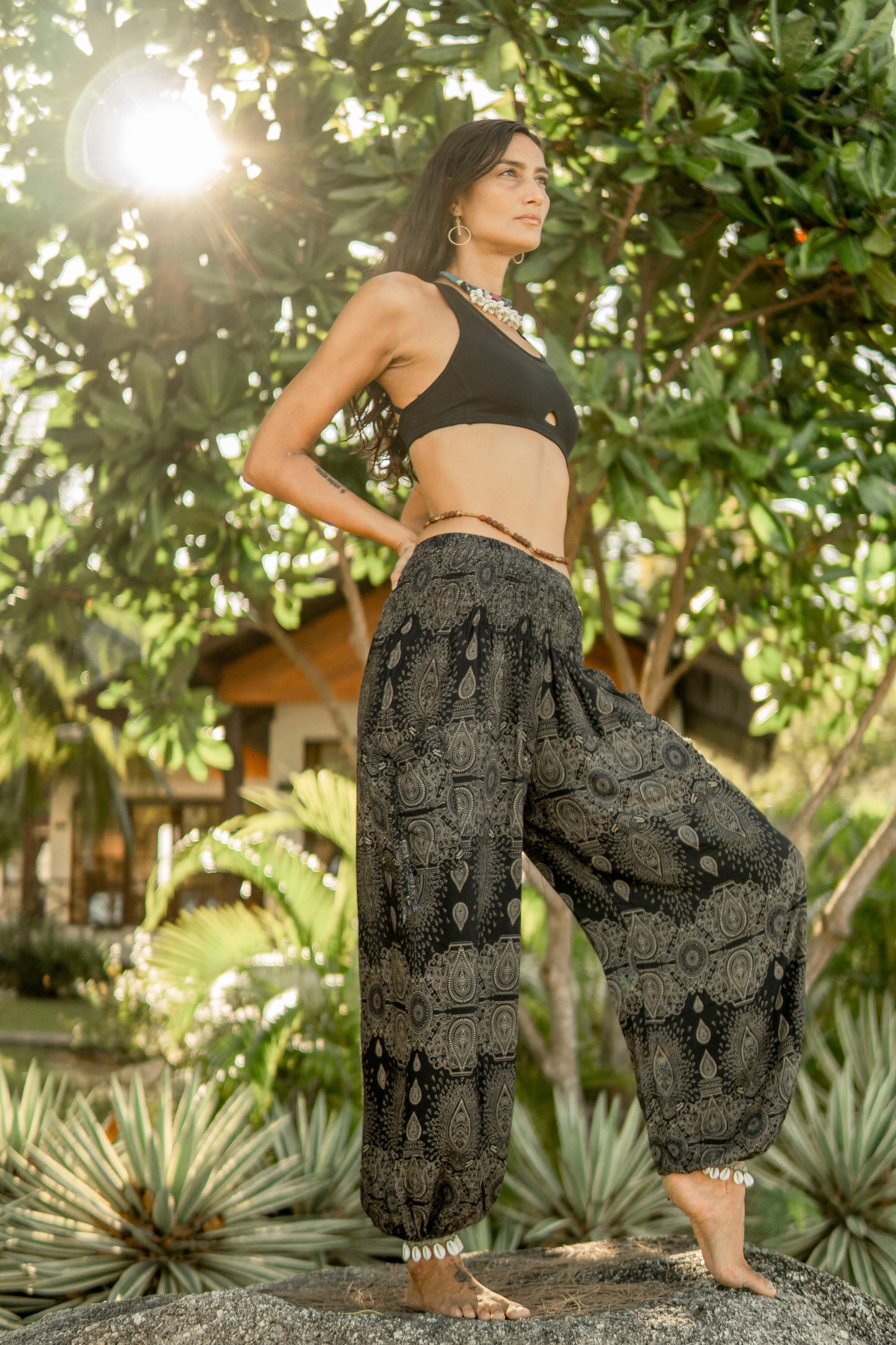 Airy harem pants with a filigree pattern in black