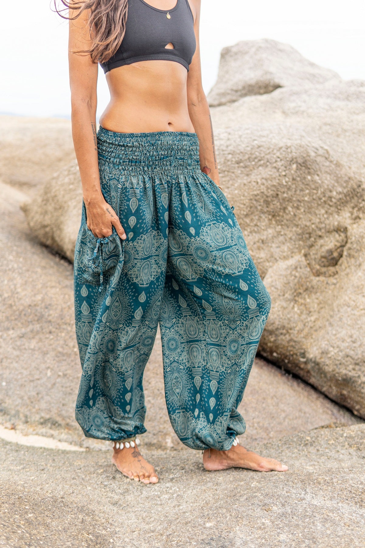Airy harem pants with a filigree pattern in turquoise