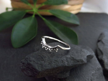 simple silver ring with small dots 