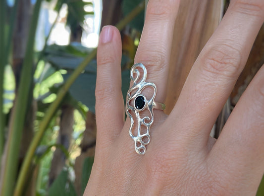 Ornate silver ring with spirals and black stone 