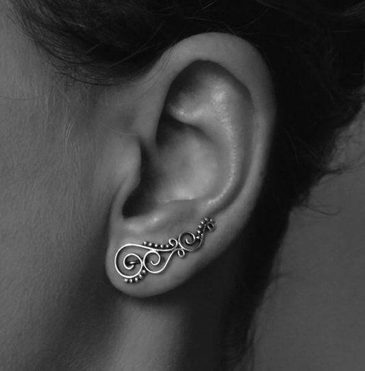 Earclimber earrings with spirals and dots made of silver 
