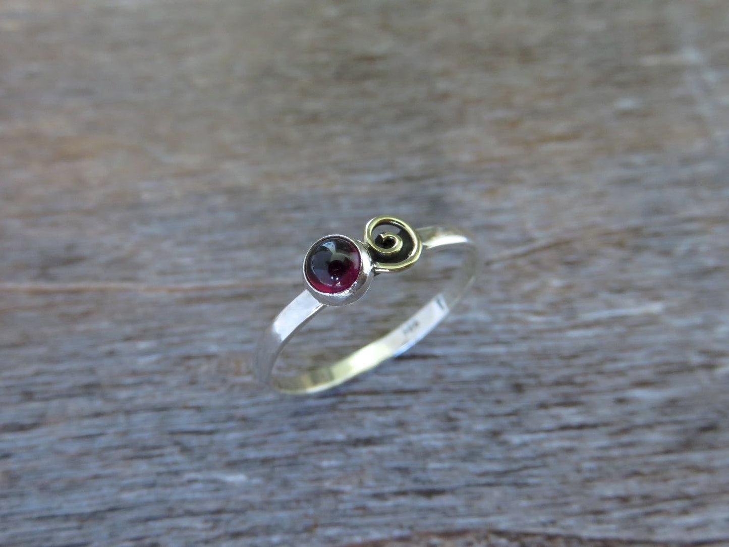 Silver ring with spiral made of brass and red stone 
