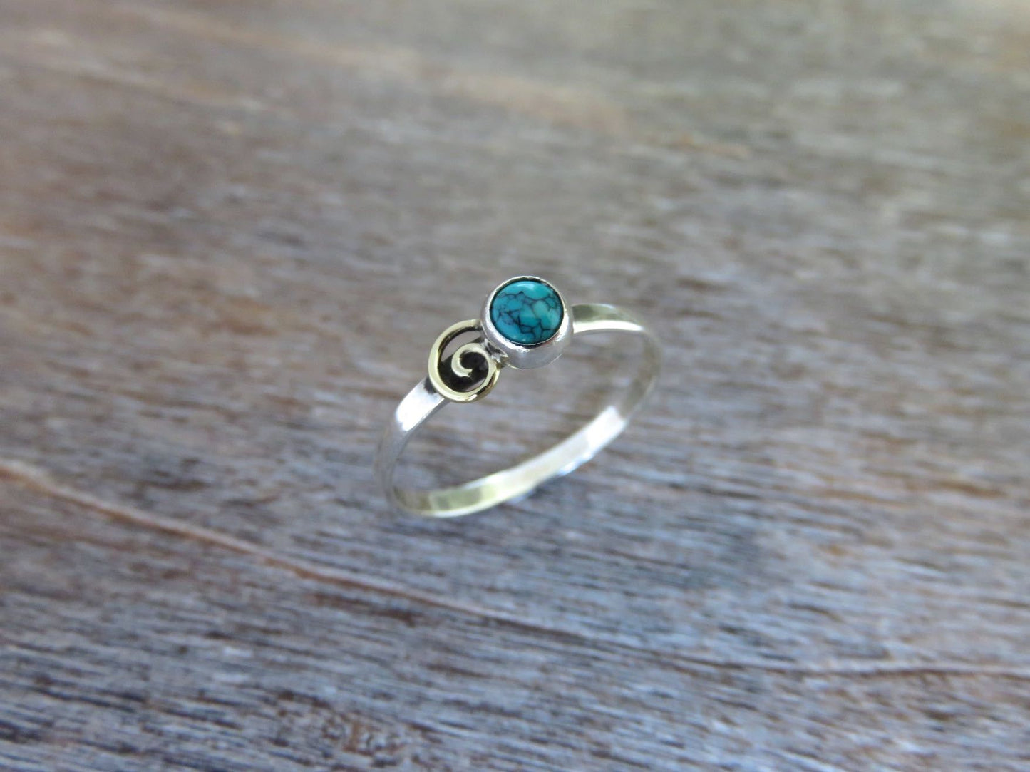 Silver ring with spiral made of brass and turquoise stone 
