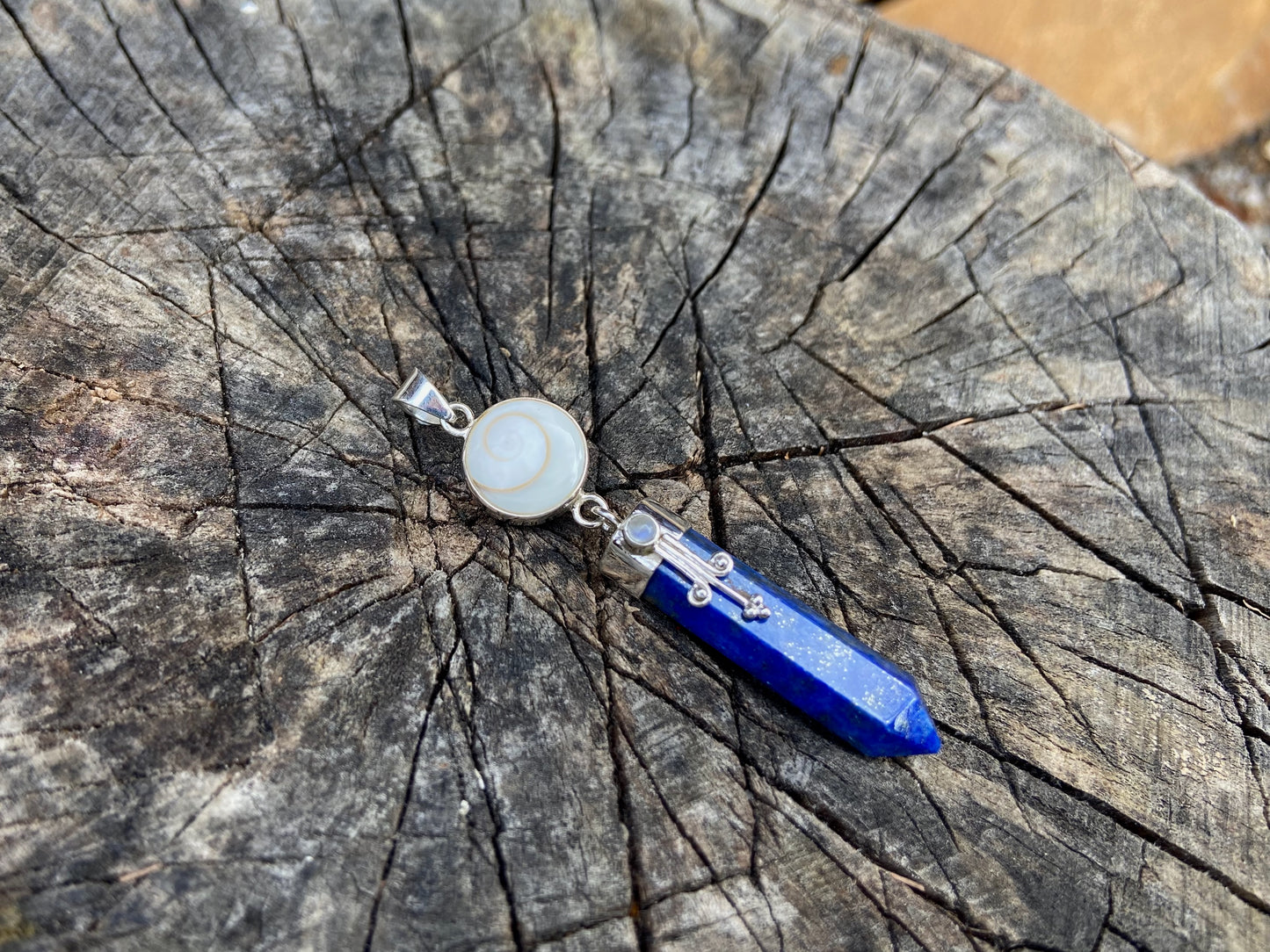 Lapis Lazuli pendant with operculum with spirals, dots and small stone, silver 