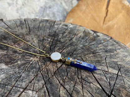 Lapis Lazuli pendant with operculum with spirals, dots and small stone, brass 