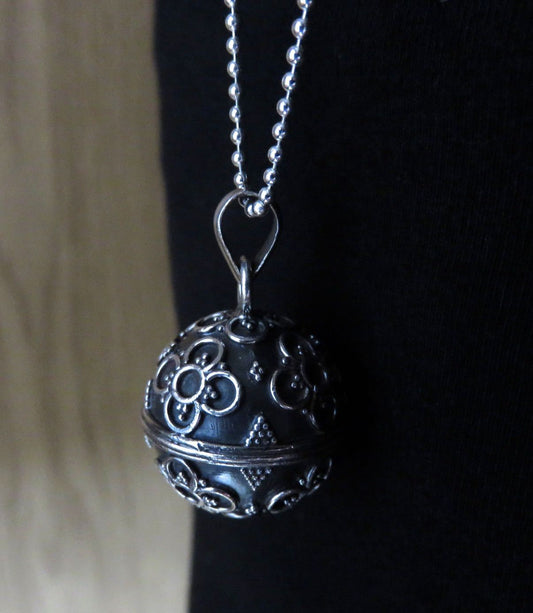 Silver sound ball decorated with flowers and beads 