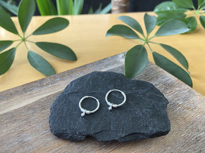 small silver hoop earrings with leaves, beads and beads 