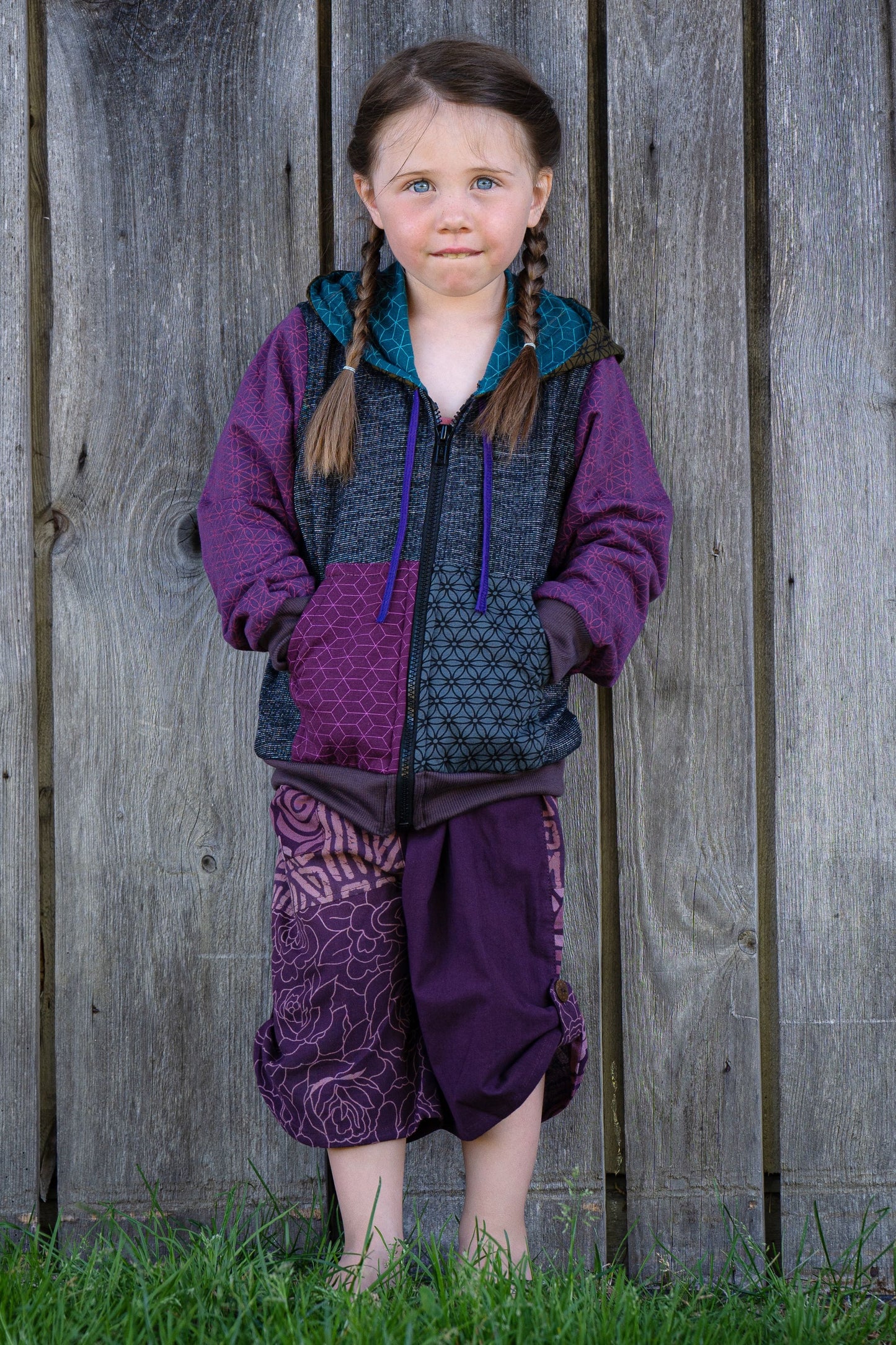 colorful patchwork children's sweater with hood in purple 