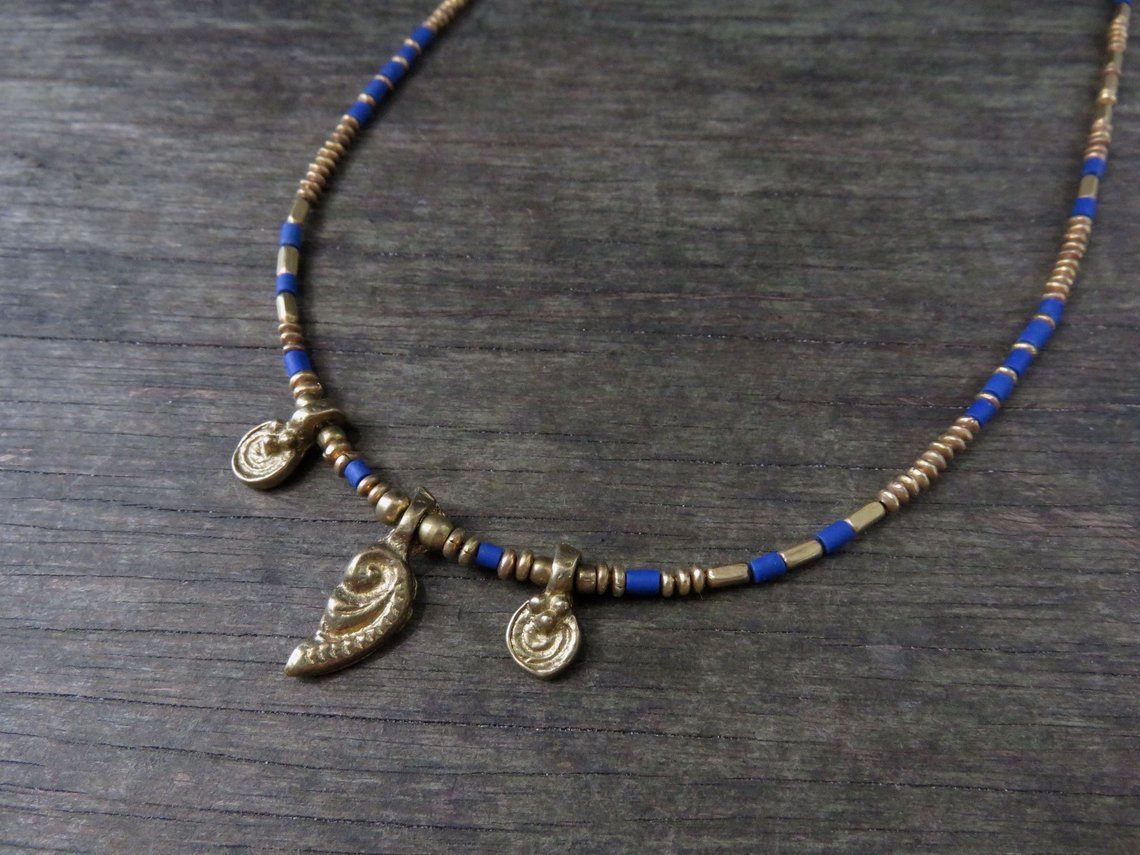 Necklace with brass pendants and colored beads 