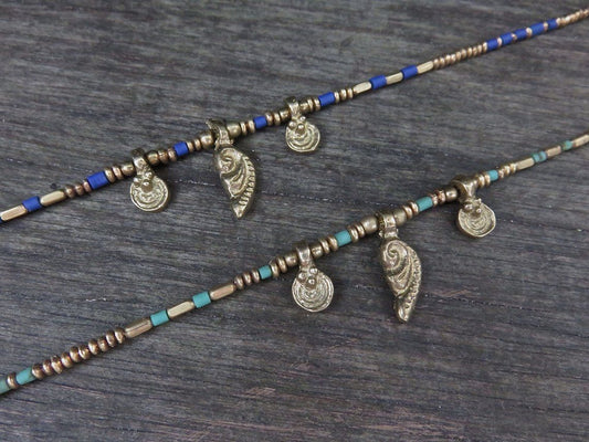 Necklace with brass pendants and colored beads 