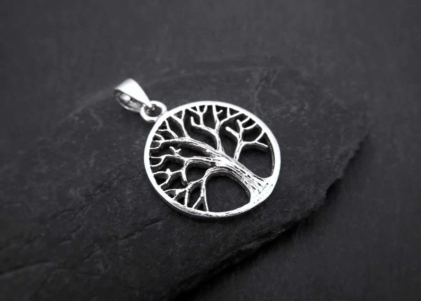 small pendant with the tree of life motif made of silver 