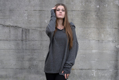 long knitted sweater with a patterned hood and thumbholes in gray 
