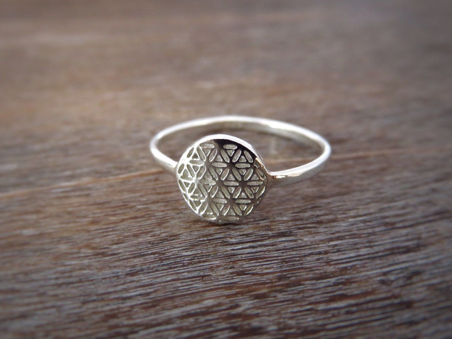 Ring with the motif of the flower of life made of silver 
