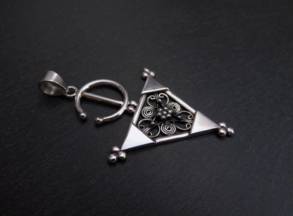 Pendant with a filigree decorated triangle made of silver 