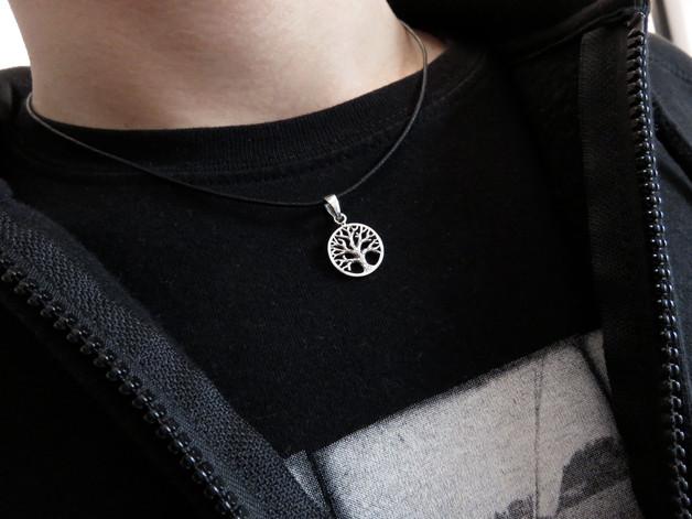 small pendant with the tree of life motif made of silver 