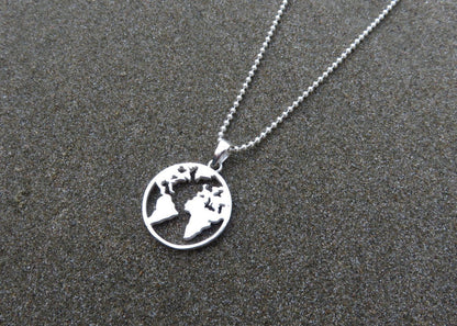 Silver world map pendant for travel lovers