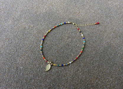 colorful anklet with a small leaf made of brass