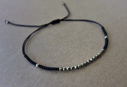 black bracelet with small pyrite stones