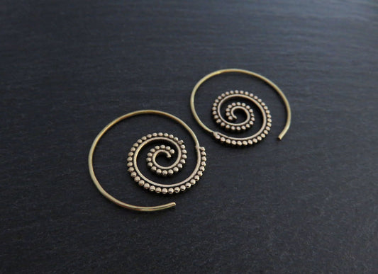 small spiral earrings with dot pattern made of brass 