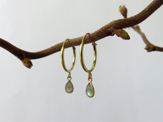 small hoop earrings with a dangling stone made of brass 