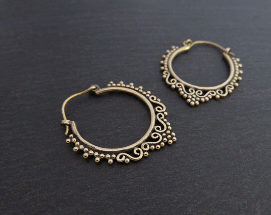 small hoop earrings decorated with spirals and dots made of brass 
