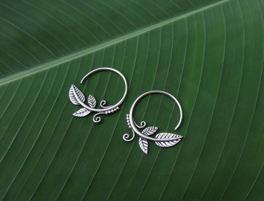 small hoop earrings with leaves and spirals made of silver 
