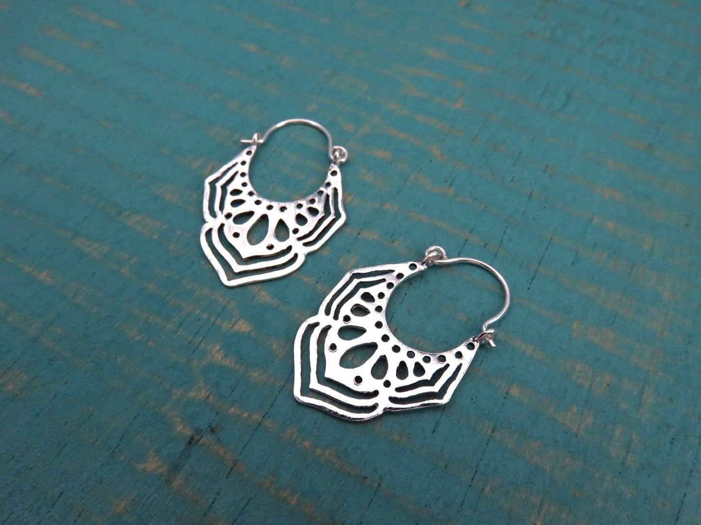 small floral patterned hoop earrings made of silver 