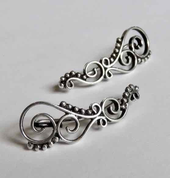 Earclimber earrings with spirals and dots made of silver 