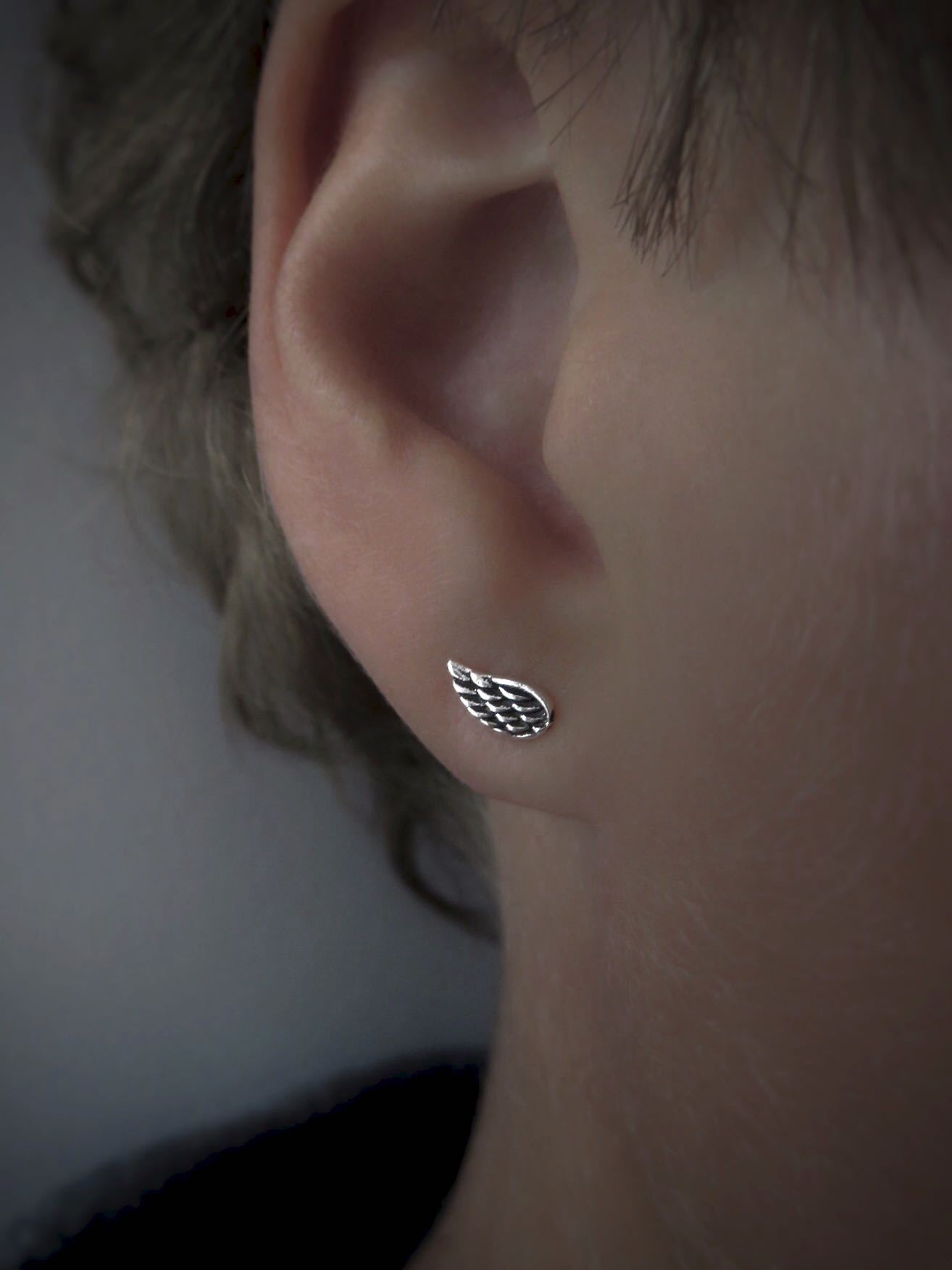 small angel wing stud earrings made of silver 