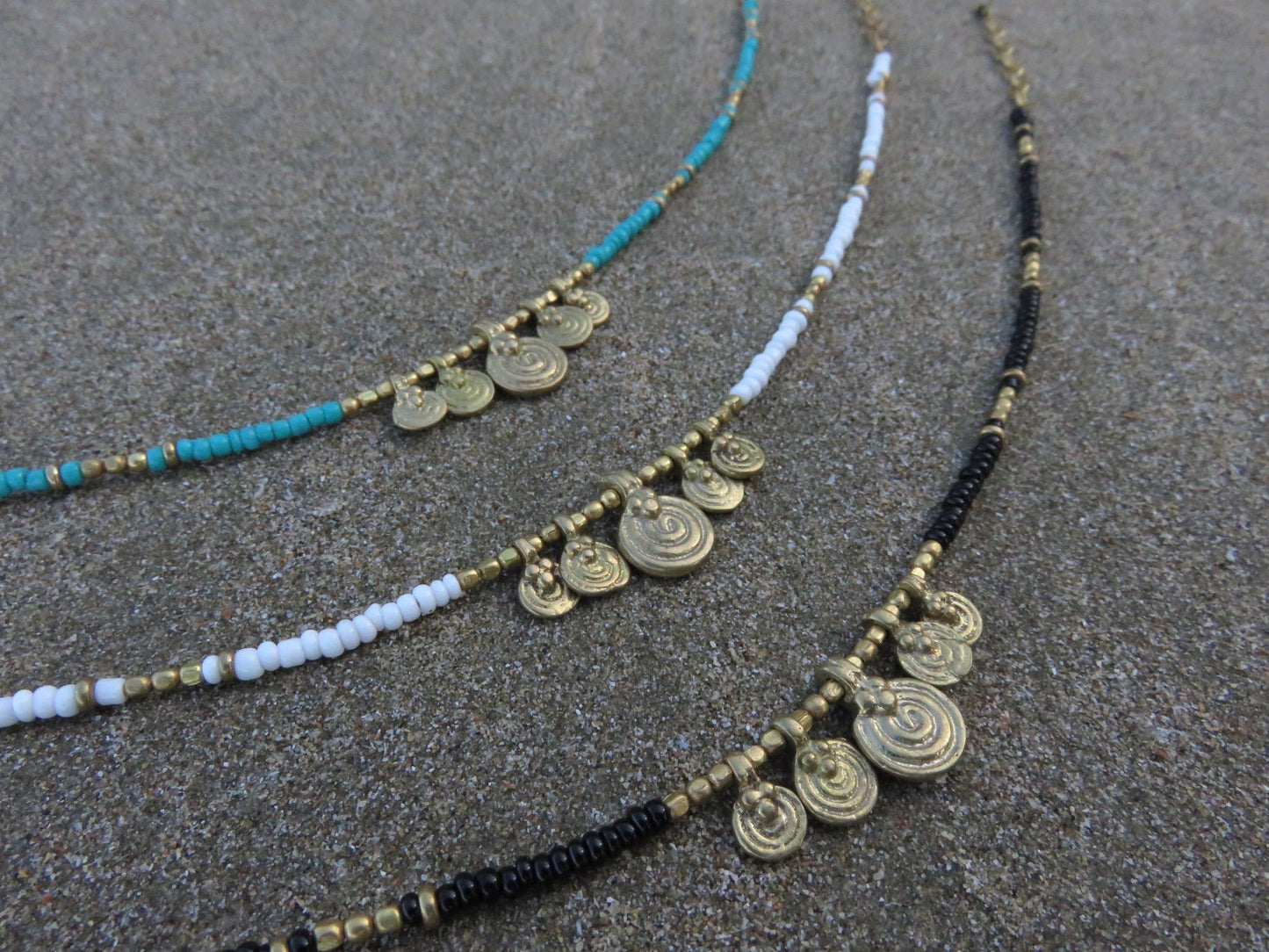 Anklet with small spiral pendants made of brass 