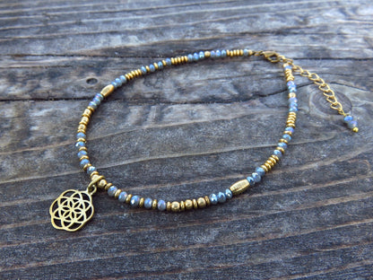 Anklet with brass flower and colored beads 
