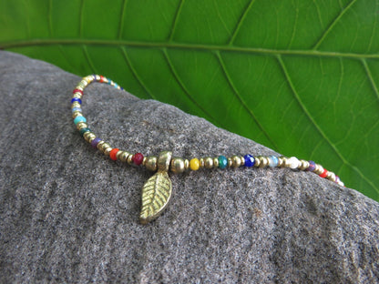 colorful anklet with a small leaf made of brass