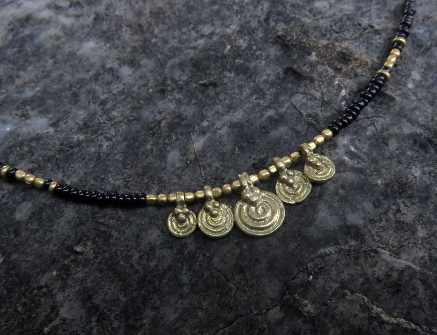 Anklet with small spiral pendants made of brass 