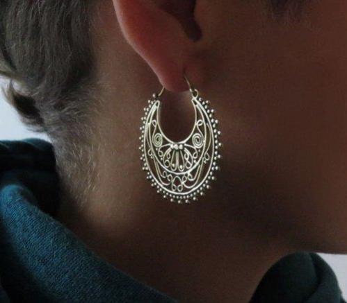 large hoop earrings with a filigree pattern made of brass 