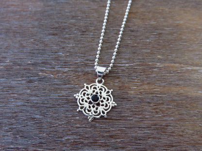 small filigree pendant with black spinel made of silver 