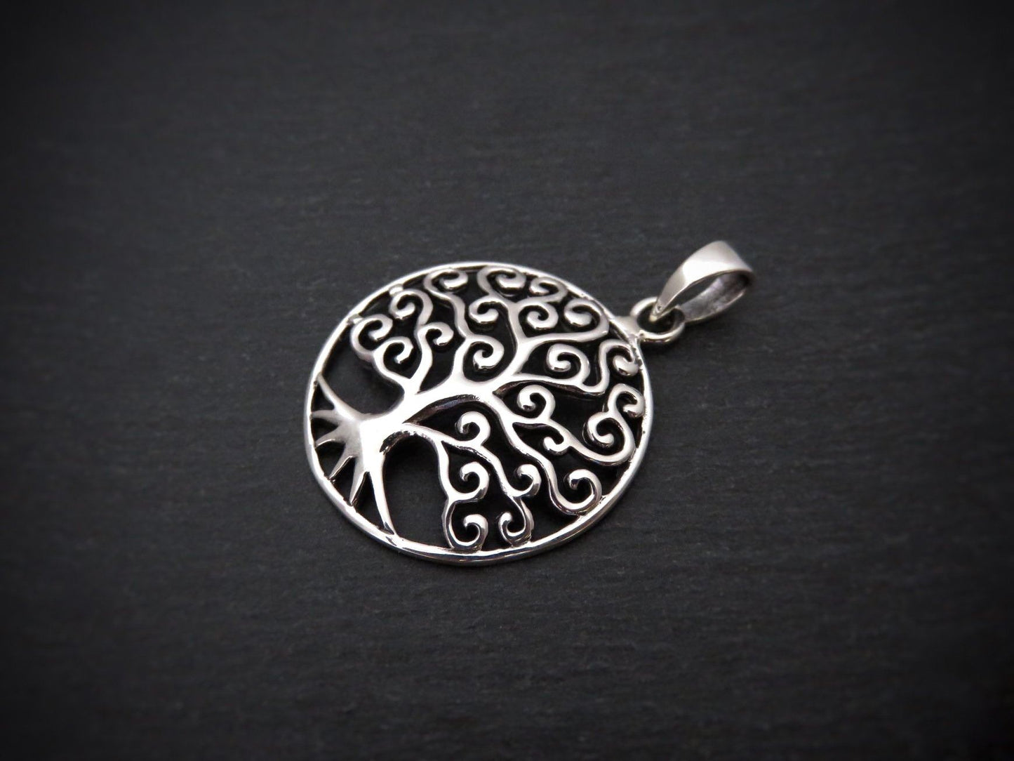 Domed pendant with the motif of the tree of life made of silver 