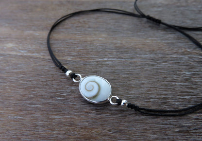 Bracelet with operculum and silver beads 