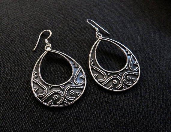 large granulated teardrop-shaped earrings made of silver 