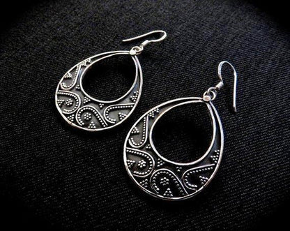 large granulated teardrop-shaped earrings made of silver 