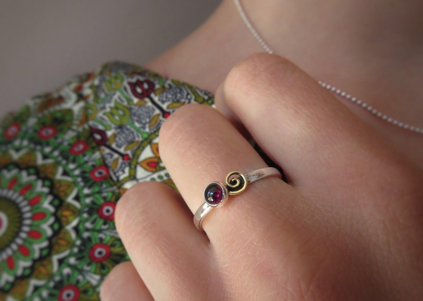 Silver ring with spiral made of brass and red stone 
