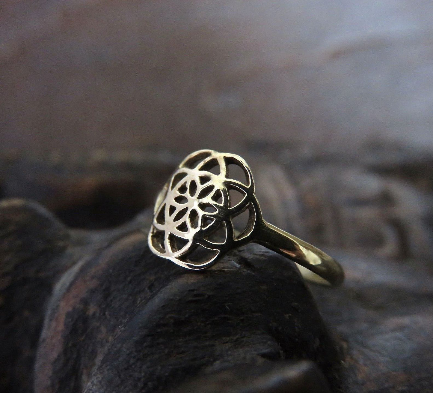 Ring with the Seed of Life motif made of brass 