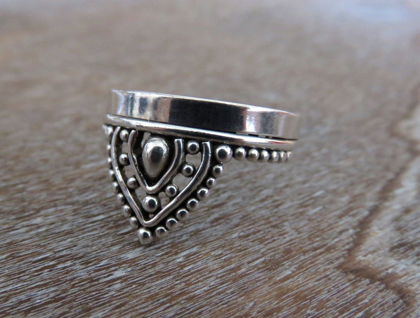 playful ring decorated with silver beads