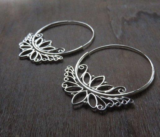 large hoop earrings with lotus flower motif made of silver 