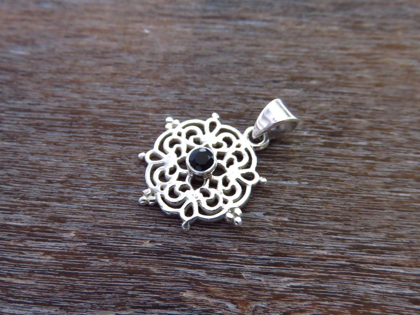 small filigree pendant with black spinel made of silver 