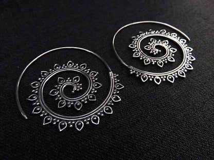 large spiral earrings with a filigree pattern made of silver 