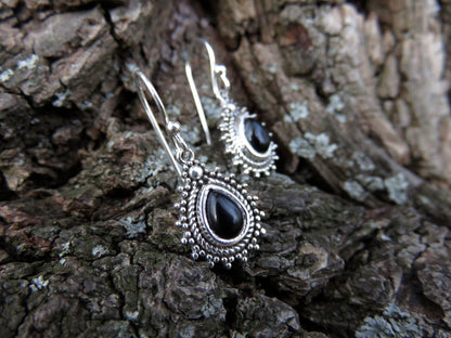 small earrings made of silver with a drop-shaped stone 