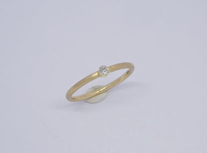 narrow handcrafted gold ring with diamond 