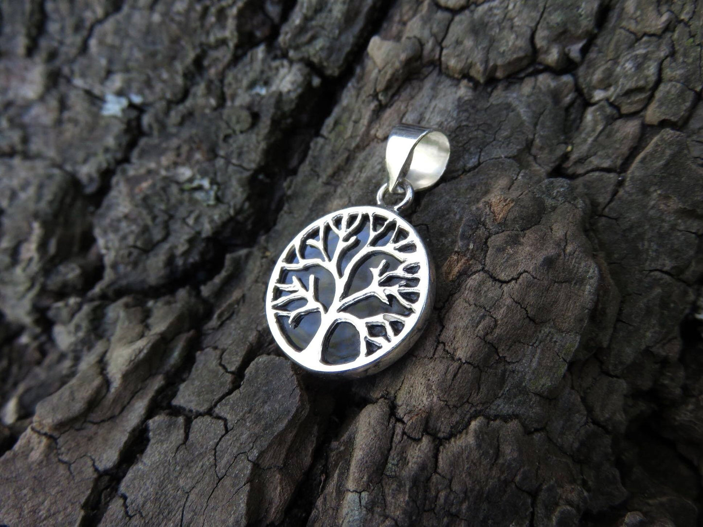Reversible pendant with the motif of the tree of life made of silver